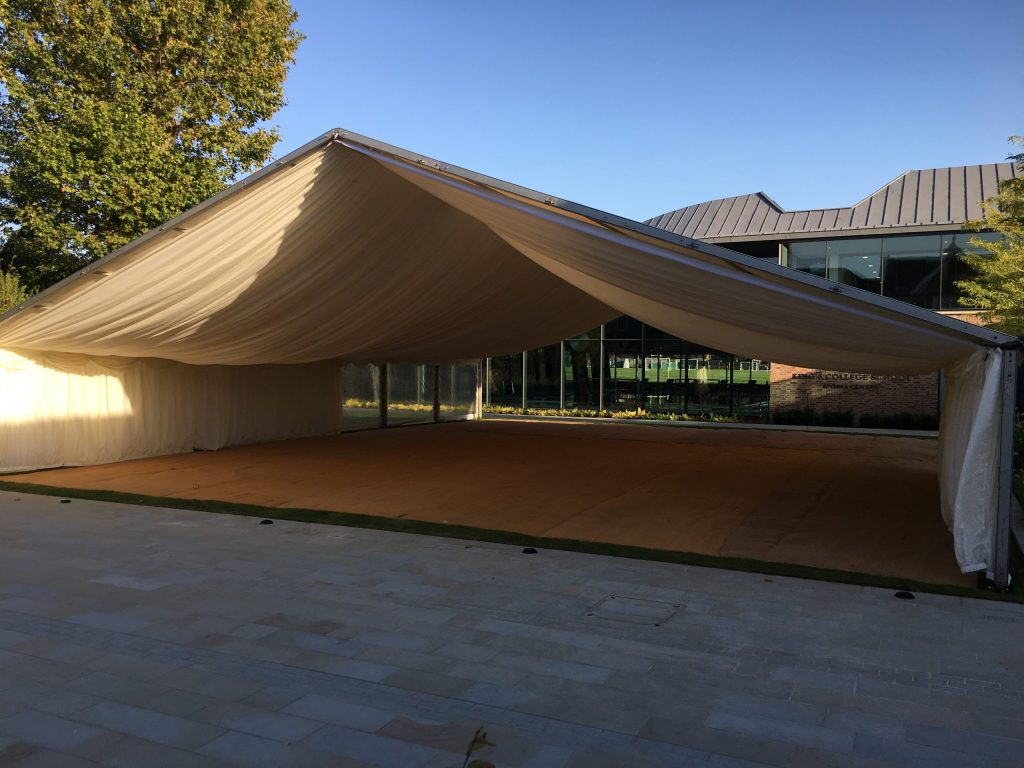 Marquee with open ends and a draped ceiling. Provided for a school prom
