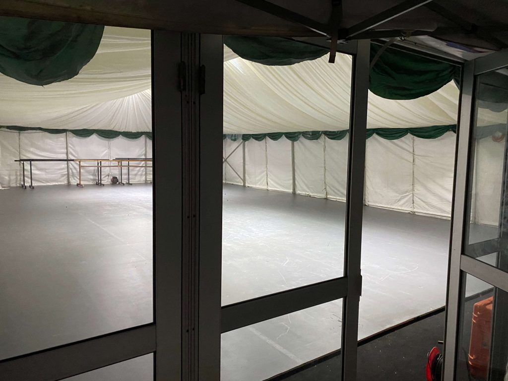 Marquee with hard sides, solid doors and hard flooring
