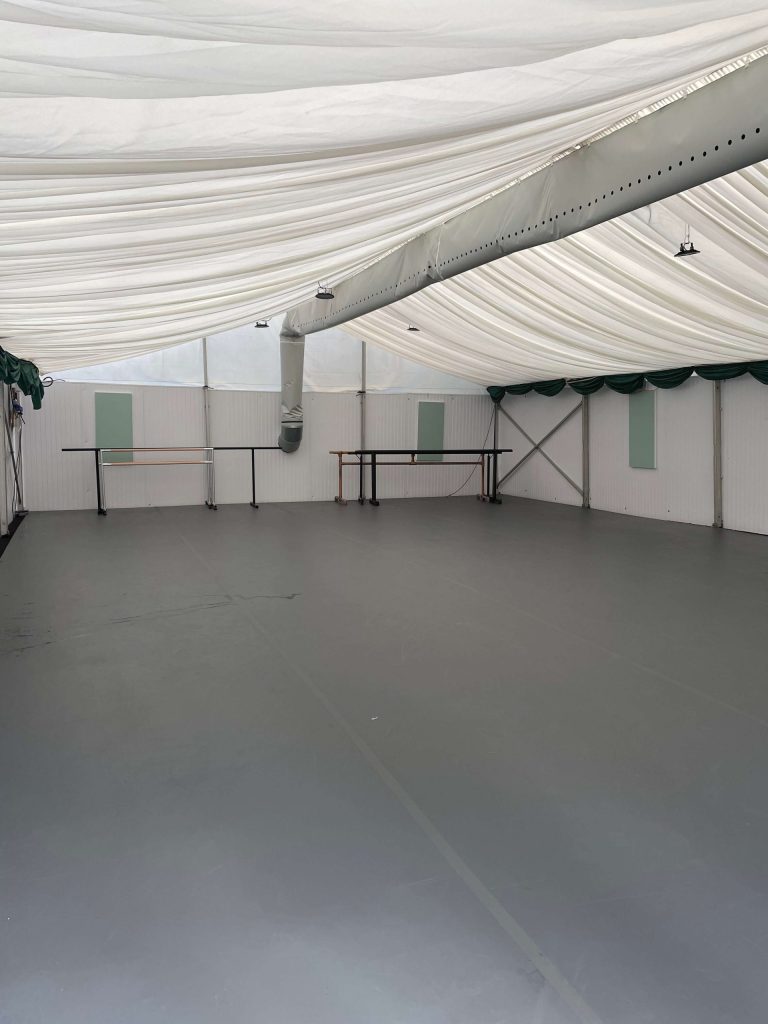 Marquee with lined ceiling, thermostatically controlled heating, hard walls and a hard floor
