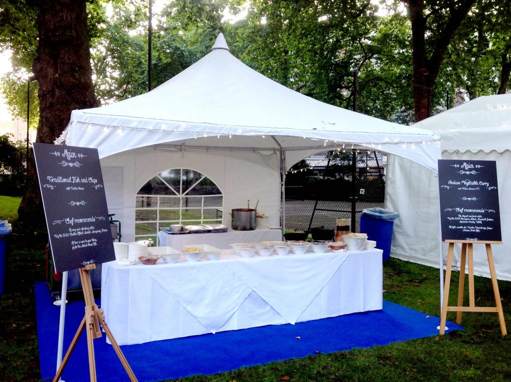 A small marquee used to protect the food from weather at a formal function