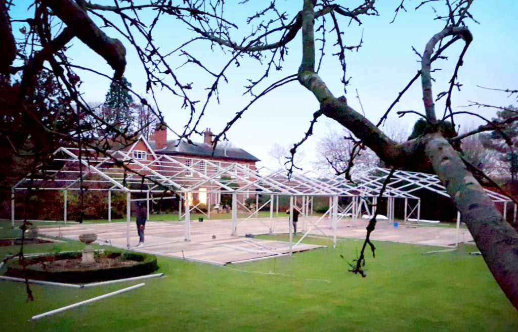 The construction of the skeleton of a marquee used as a outdoor event space