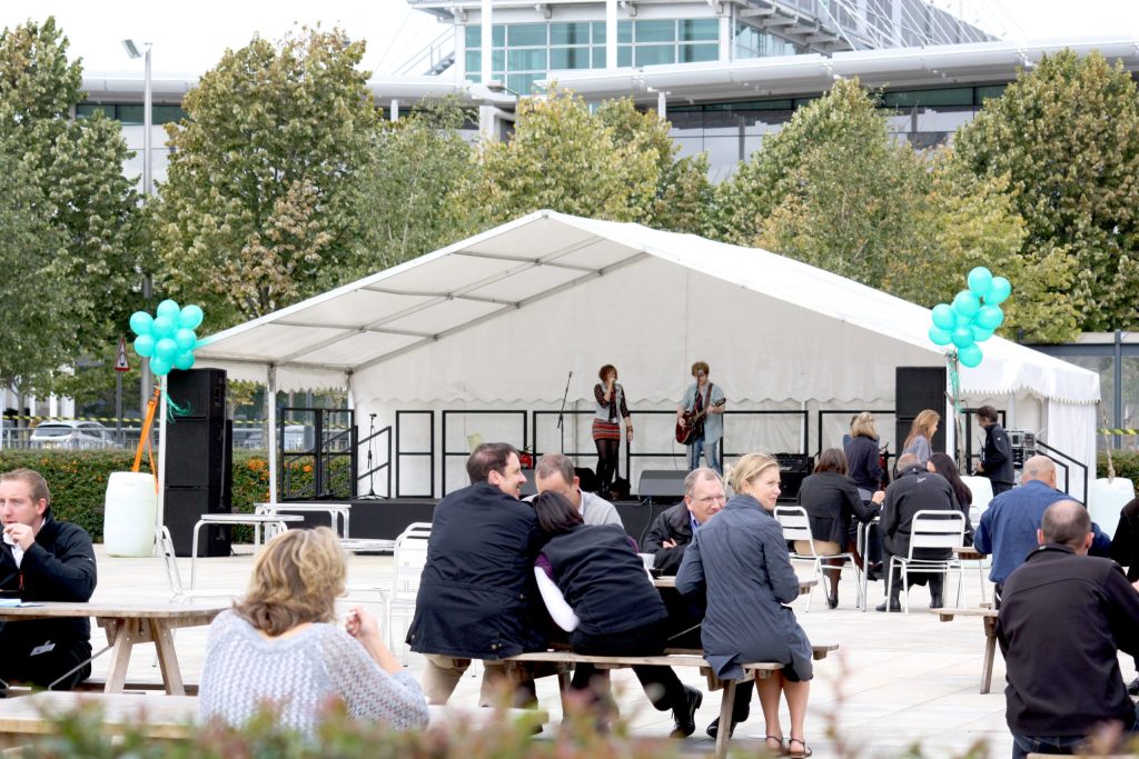 Large outdoor marquee used as a stage to host live performers