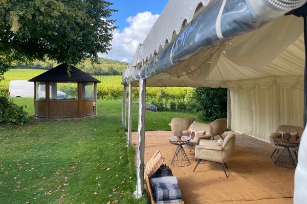 Marquee hire Surrey at Denbies Vineyard Hotel, in Dorking, Surrey. View of marquee with open sides, looking out to the Surrey Hills