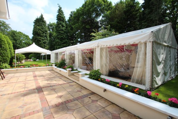 Exterior view of marquee hire in Surrey with clear panoramic windows